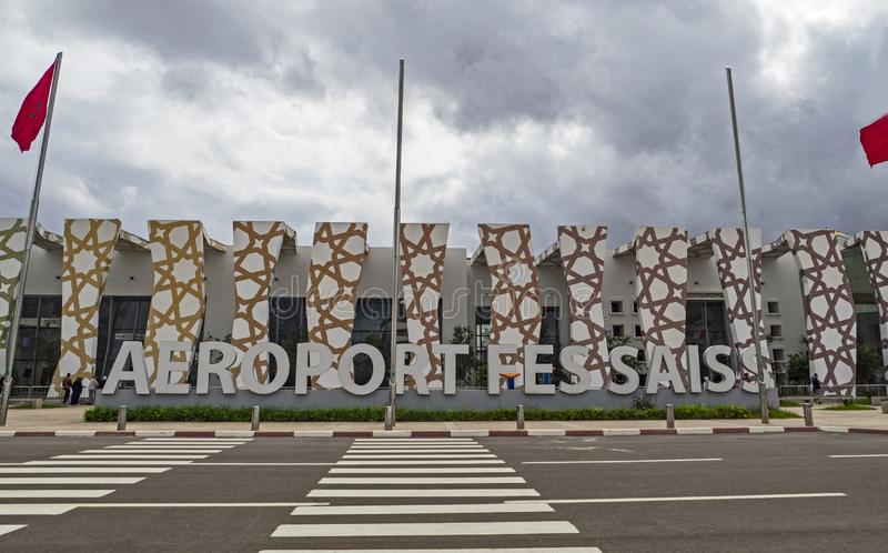 fes-sais-airport-exterior-stunningly-designed-building-greets-visitors-to-morocco-october-flag-reflects-129478285